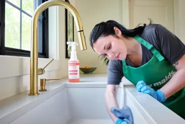 merry maid cleaning a kitchen sink
